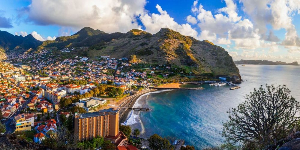 Breathtaking scenery of Madeira island, View of Machico town and beautiful bay with sandy beach. Eastern part of the island. Portugal travel